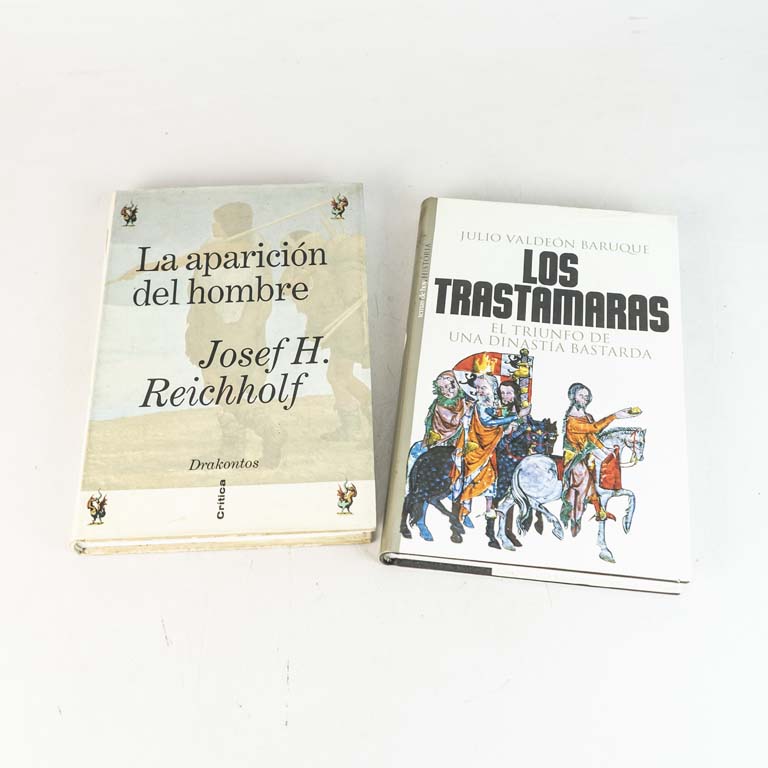 2 libros: Los trastamaras El triunfo de una dinastía bastarda por Julio Valdeón Baruque, de tapa dura y La aparición del hombre por José Reichholf